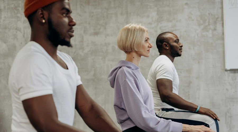 Group of diverse people practicing yoga together.